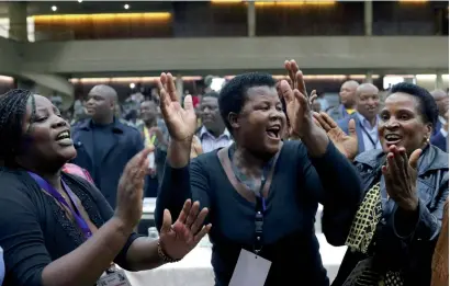  ?? Reuters ?? Delegates celebrate after President Robert Mugabe was dismissed as party leader in Harare on Sunday. —