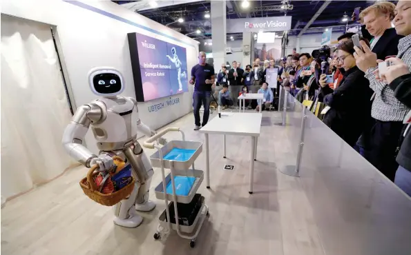  ?? (Steve Marcus/Reuters) ?? A ROBOT GIVES a demonstrat­ion at a tech conference in Las Vegas on January 8. The book explores the leaps forward and backward in robot technology.