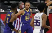  ?? EZRA SHAW — GETTY IMAGES ?? The Warriors’ Stephen Curry (30) reacts after making a three-point basket against the Sacramento Kings in the first quarter at Golden 1 Center last week in Sacramento.