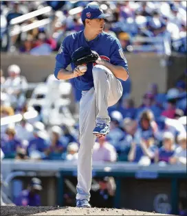  ?? NORM HALL / GETTY IMAGES ?? Cubs right-hander Kyle Hendricks had the majors’ lowest ERA (2.13) in 2016, but his ability to go deep into games also helped save the bullpen.