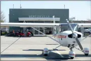  ?? NWA Democrat-Gazette/BEN GOFF • @NWABENGOFF ?? A plane used by Summit Aviation sits in front of the Summit Aviation office Monday at Bentonvill­e’s airport. Plans for a new flight center and museum on the northwest side of the runway, which will become the main entrance to the airport, include space...