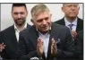  ?? (AP/Darko Bandic) ?? Chairman of Smer-Social Democracy party Robert Fico (center) addresses the results of an early parliament­ary election on Sunday during a news conference in Bratislava, Slovakia.