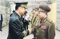  ?? PHOTO: REUTERS ?? Getting to know you . . . South Korean Major General Kim Dogyun (left) is greeted by North Korean Lieutenant General An Iksan before their highlevel military talk at the northern side of the truce village of Panmunjom, in North Korea, yesterday.