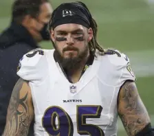  ?? Ap fiLE pHOTOS ?? MAKING MOVES: Ravens defensive lineman Derek Wolfe is a good target for the Patriots this offseason, as he is currently playing out a one-year, $3 million deal and finished this season as the NFL’s third-best run defending D-lineman, per Pro Football Focus. Patriots defensive linemen Lawrence Guy, seen below talking to the defense, is the team’s top run defender and should be prioritize­d.