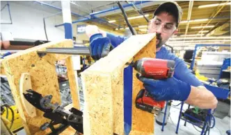  ?? STAFF FILE PHOTO ?? Charlie Waldo builds the framework for the standard La-Z-Boy recliner in Plant 6 at the Dayton facility.