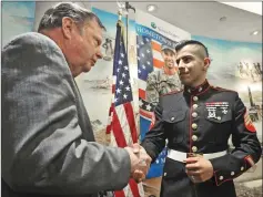  ?? Signal file photo ?? City Councilman Bob Kellar, left, discusses the “Hometown Heroes” Military Banner program with United States Marine Sgt. David Gonzalez after a press conference in March 2016.