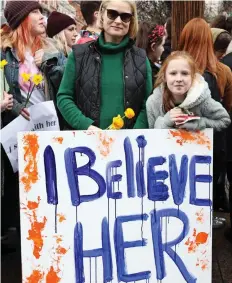  ??  ?? Solidarity: Many carried ‘I believe her’ placards