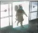  ??  ?? A suspected mass shooting gunman entering the Santa Monica College library June 7, 2013.