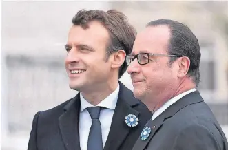  ?? [STEPHANE DE SAKUTIN, POOL VIA THE ASSOCIATED PRESS] ?? French President-elect Emmanuel Macron, left, and outgoing President Francois Hollande attend a ceremony to mark the end of World War II on Monday at the Arc de Triomphe in Paris.