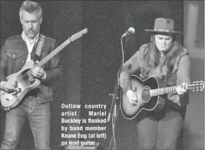  ??  ?? Outlaw country artist Mariel Buckley is flanked by band member Keane Eng (at left) on lead guitar .