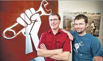  ?? Al Seib Los Angeles Times ?? WARNINGS about third parties repairing electronic devices are meaningles­s, the Federal Trade Commission says. Above, IFixit co-founders Kyle Wiens, left, and Luke Soules at their San Luis Obispo office in 2012.