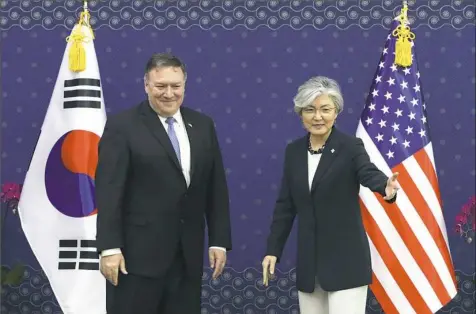  ?? Chung Sung-Jun/Pool Photo via AP ?? U.S. Secretary of State Mike Pompeo stands with South Korean Foreign Minister Kang Kyung-wha during their meeting early Thursday at the Foreign Ministry in Seoul, South Korea.