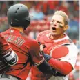  ?? Jeff Roberson / Associated Press ?? Held back by Daniel Descalso, Yadier Molina yells at Arizona manager Torey Lovullo.