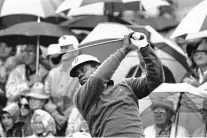  ?? Associated Press file photo ?? Lee Elder watches the flight of his ball as he tees off at the 1975 Masters in Augusta, Ga., breaking a barrier as a Black golfer.