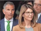  ?? STEVEN SENNE/AP ?? Actress Lori Loughlin and her husband, clothing designer Mossimo Giannulli, are accused of paying $500,000 in bribes to coaches.