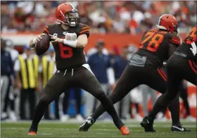  ?? JEFF HAYNES — THE ASSOCIATED PRESS ?? Baker Mayfield looks to pass as Greg Robinson blocks during the Browns’ loss to the Titans on Sept 8.