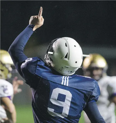  ?? GERRY KAHRMANN/PNG ?? Notre Dame Jugglers quarterbac­k Steve Moretto points skyward in tribute to his former coach and his grandparen­ts after his touchdown against the Vancouver College Fighting Irish.