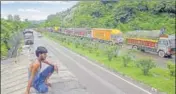  ?? PTI ?? Stranded trucks await opening of the Jammu-srinagar national highway, on the outskirts of Jammu, on Friday.