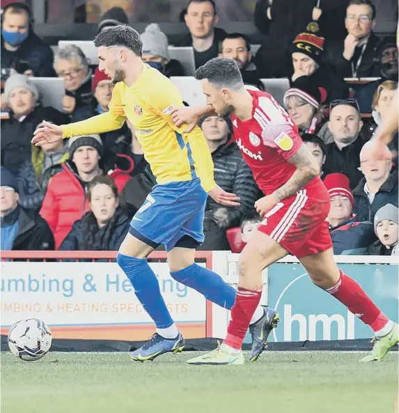  ?? ?? Leon Dajaku holds off an Accrington player.