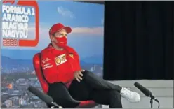  ??  ?? Sebastian Vettel, piloto de Ferrari, ayer en Hungarorin­g.