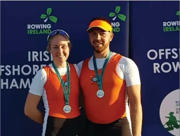  ??  ?? Cormac Kelly and Síonna Healy receiving their silver medals following their mixed race final.