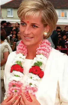  ?? PHOTO: AP ?? Diana wears a traditiona­l garland of flowers given to her on her arrival at the Shri Swaninaray­an Mandir Hindu temple in north London in June 1997. The Princess also had a traditiona­l red vermillion mark placed on her forehead.