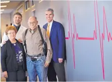  ?? JIM THOMPSON/JOURNAL ?? Drs. Faisal Zaeem and Dana Booth stand with Pilar and Arturo Madrid, the first patient in New Mexico to receive a left ventricula­r assist device (LVAD). Arturo Madrid is carrying the batteries and computer needed to power and control the device.