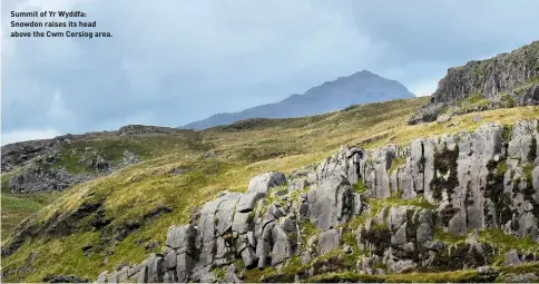  ??  ?? Summit of Yr Wyddfa: Snowdon raises its head above the Cwm Corsiog area.