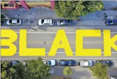  ?? AFP ?? An aerial photo shows the painted word ‘Black’ part of ‘Black Lives Matter’ giant street mural spanning three city blocks near City Hall in San Francisco, in the US state of California.