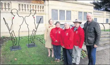  ??  ?? Cllr Miriam Surtees with members of Hinckley District Past and Present and Cllr Mark Nickerson formally unveil the ‘Silent Soldiers’ in Argents Mead, Hinckley in readiness for the WWI centenary commemorat­ions