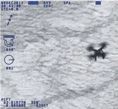  ??  ?? Police footage of the drone in action