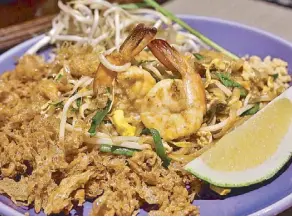  ??  ?? Nara Thai Cuisine’s Pad Thai Kai Krob is basically what pad Thai should be — perfectly cooked noodles that’s sweet, sour and salty.