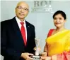  ?? ?? Board of Investment Chairman Raja Edirisuriy­a and BOI Director General Renuka Weerakone with the silver award
