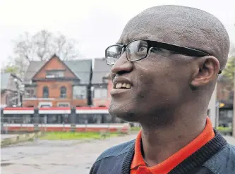  ?? REUTERS ?? Apollinair­e Nduwimana, a Burundian teacher and asylum-seeker who is awaiting a refugee applicatio­n, poses outside a school near his lodging in Toronto last Thursday.