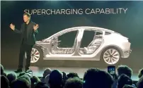  ?? — AP file ?? Elon Musk speaks at the unveiling of the Model 3 at the Tesla Motors design studio in Hawthorne.