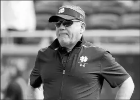  ?? PHELAN M. EBENHACK/AP ?? Notre Dame head coach Brian Kelly watches warmups before the Camping World Bowl against Iowa State in Orlando, Fla., on Dec. 28, 2019.