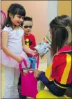  ?? Bruce Edwards/postmedia News ?? Isabella Brezden, 5, brings her little brother Maxwell, 3, to Edmonton’s Maier Centre for Autism Services, on Monday.