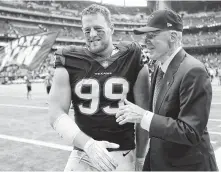  ?? Brett Coomer / Houston Chronicle ?? Defensive end J.J. Watt and owner Bob McNair celebrate the Texans’ 57-14 win over the Titans at NRG Stadium in 2017.