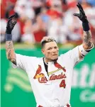  ?? JEFF ROBERSON/ASSOCIATED PRESS ?? St. Louis catcher Yadier Molina celebrates after hitting a game-winning sacrifice fly in the 10th inning of Game 4 on Monday.