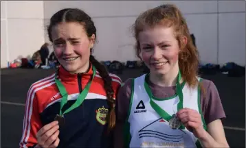  ??  ?? Claragh Keane and Elizabeth Gahan with their medals after the recent South Leinster finals.