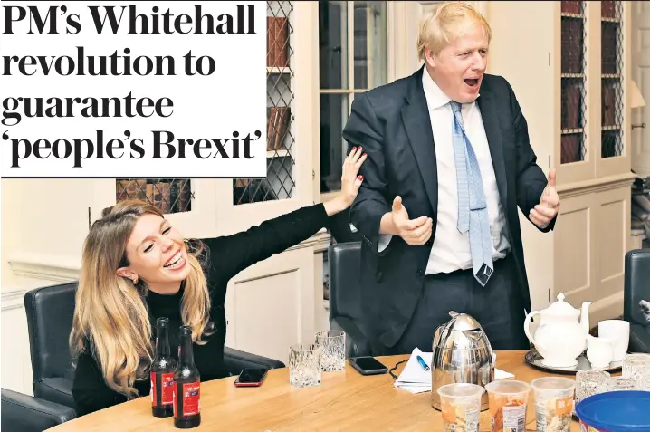  ??  ?? Mr Johnson and Carrie Symonds watch the election results on TV at 10 Downing Street, with Budweiser beer, coffee and Co-op pasta snack pots at the ready