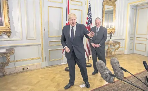  ??  ?? > Foreign Secretary Boris Johnson and his US counterpar­t Rex Tillerson at Mr Johnson’s grace and favour home in London yesterday