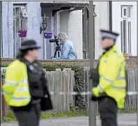  ?? AP/VICTORIA JONES ?? Police and forensic officers work Saturday at a property in southwest London as they investigat­e Friday’s subway bombing. A suspect in the bombing was arrested Saturday.