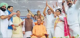  ??  ?? ▪ Chief minister Yogi Adityanath, governor Ram Naik and deputy CM Dinesh Sharma at Ambedkar Mahasabha function organised to mark the 127th birth anniversar­y of Dr BR Ambedkar. A chair with the words ‘Dalit Mitra’ painted on it was presented to Yogi on...