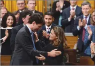  ?? CP FILE PHOTO ?? Minister of Foreign Affairs Chrystia Freeland is congratula­ted by Prime Minister Justin Trudeau and party members after delivering a speech in the House of Commons on Canada’s Foreign Policy.