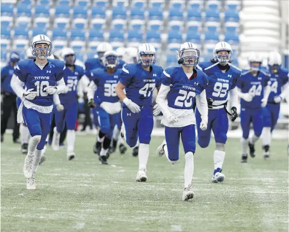  ?? IAN KUCERAK ?? The Harry Ainlay Titans football team won an Alberta provincial championsh­ip, a feat later matched by the school’s basketball and volleyball squads. It marked the first time in Alberta Schools Athletic Associatio­n history that three teams from the same school won titles in the same season.