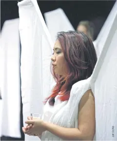  ??  ?? A member of the ‘Angels Force’ pauses during a memorial service on the first anniversar­y of the Pulse nightclub shootings in Orlando, Florida.