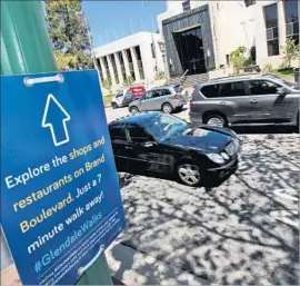  ?? Roger Wilson Glendale News Press ?? ONE OF THE 50 new signs along Glendale streets that direct visitors to local attraction­s and encourage people to walk. They will be up for only a few months.