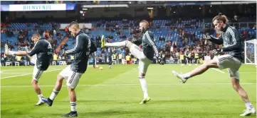  ?? — Reuters photo ?? Real Madrid’s Karim Benzema (second right) and Gareth Bale with team mates during the warm up before the La Liga match at Santiago Bernabeu in Madrid, Spain.