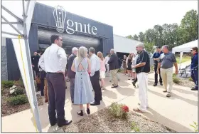  ?? NWA Democrat-Gazette/FLIP PUTTHOFF ?? Guests gather Wednesday for the opening of Ignite profession­al studies program in Bentonvill­e, where high school students hone their skills in a number of career fields.